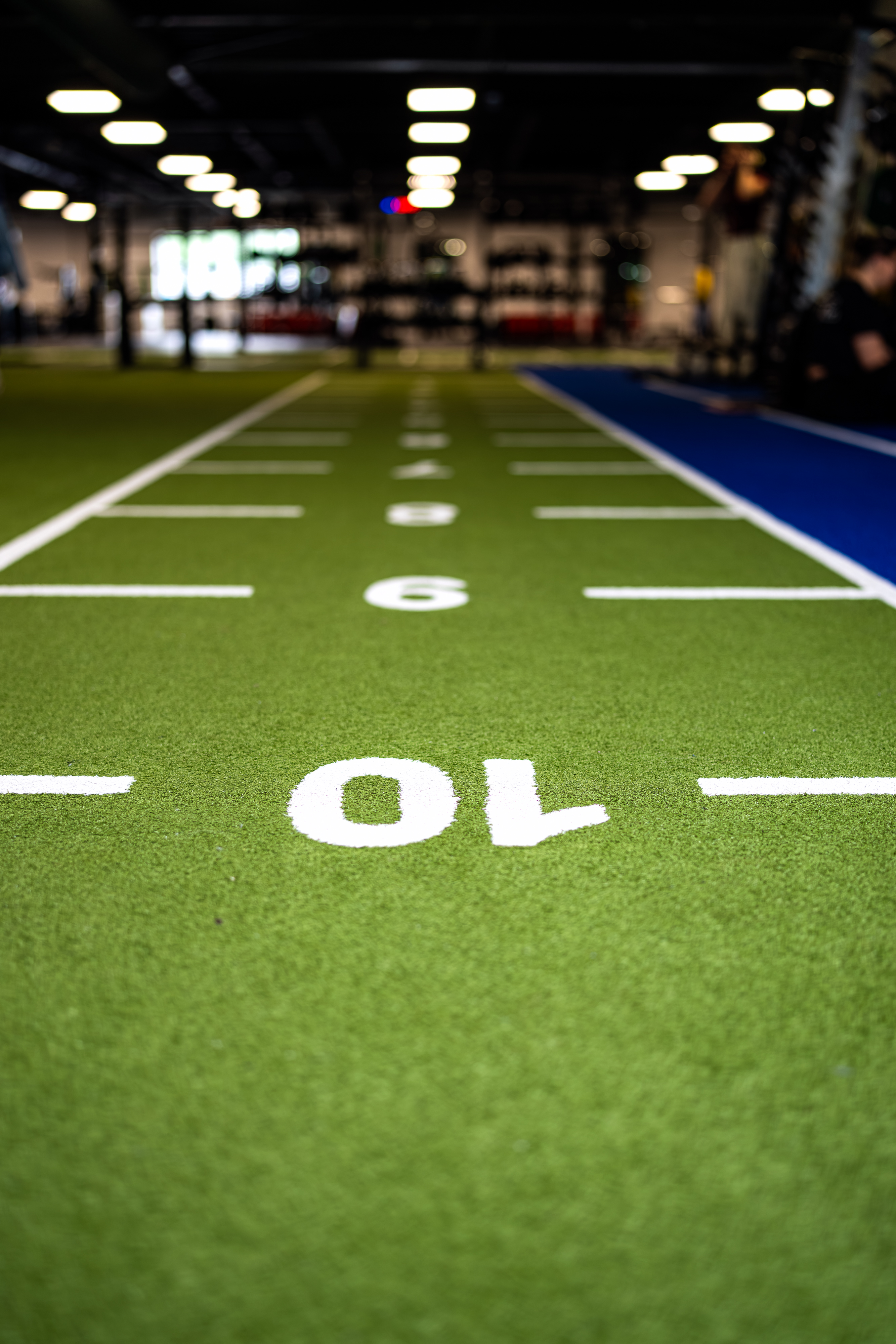 Detail van de groene sprintbaan in de gym